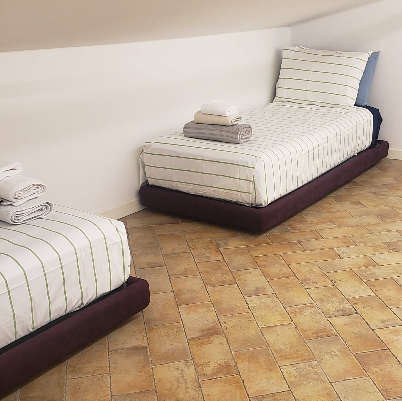 There are two twin beds downstairs.